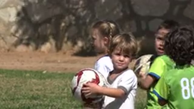LOS CABOS MEXICO-2019: Male And Female Children In Line Practicing For A Game Of Soccer