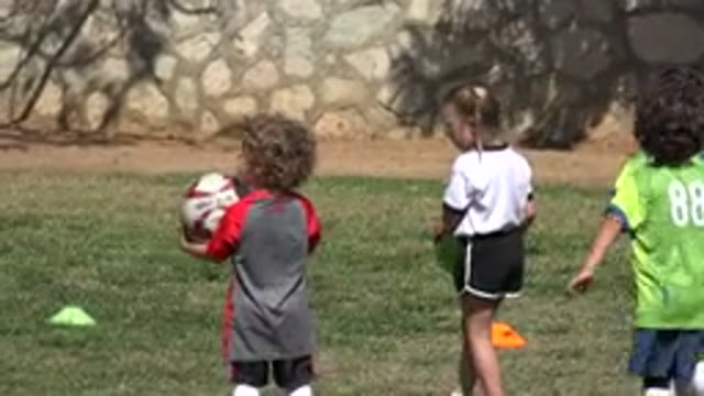 LOS CABOS MEXICO-2019: Many Kids Having Fun And Playing Soccer In A Soccer Field
