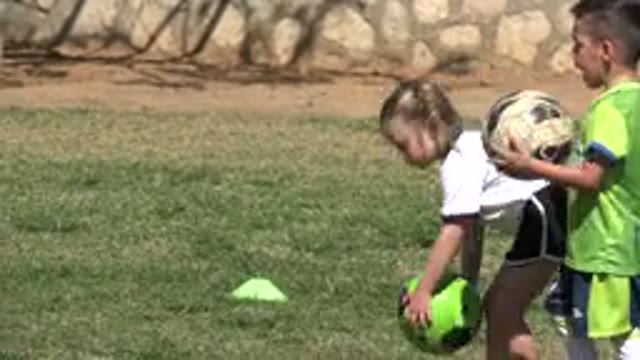LOS CABOS MEXICO-2019: Kids Lined Up With Soccer Balls Outside Getting Prepared