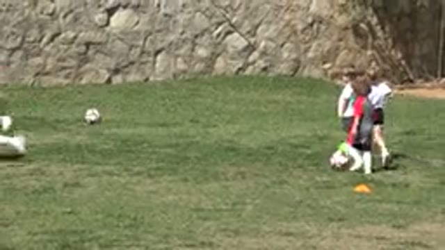 LOS CABOS MEXICO-2019: Little Girl Prepares To Kick A Ball To The Goal