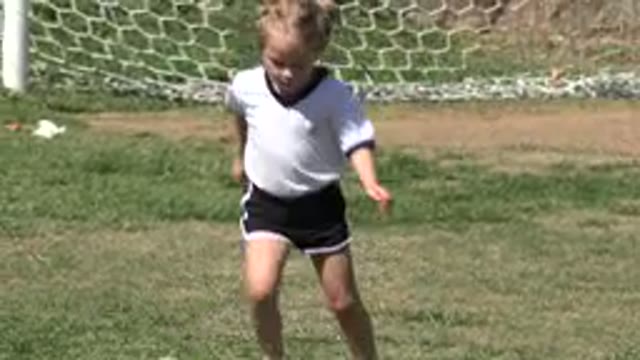 LOS CABOS MEXICO-2019: Little Blond Girl Playing Football On The Field Just