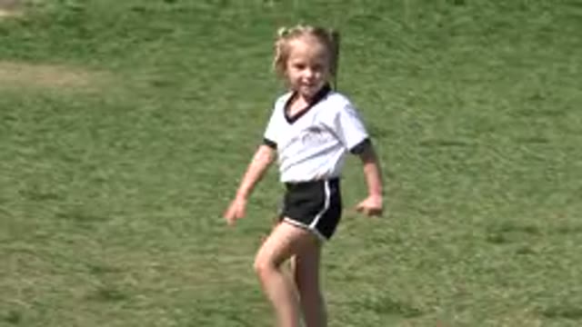 LOS CABOS MEXICO-2019: A Young Girl Practices And Plays Soccer Outside In