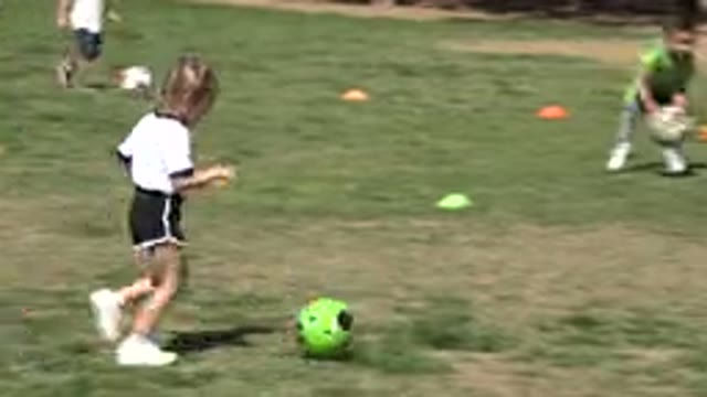 LOS CABOS MEXICO-2019: Children Kick A Soccer Ball And Then A Child Picks Up A