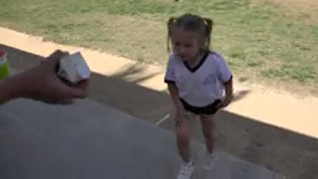 LOS CABOS MEXICO-2019: Young Girl Takes Break From Soccer Match To Drink Juice
