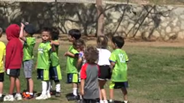 LOS CABOS MEXICO-2019: Children Playing Football With Classmates On A Hot And Sunny Day
