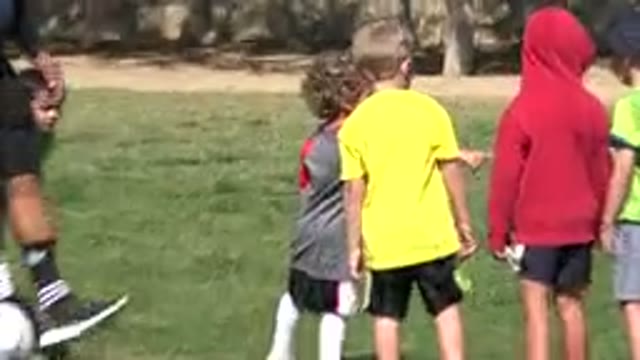 LOS CABOS MEXICO-2019: Boys And Girls Talking On A Soccer Field With Adult