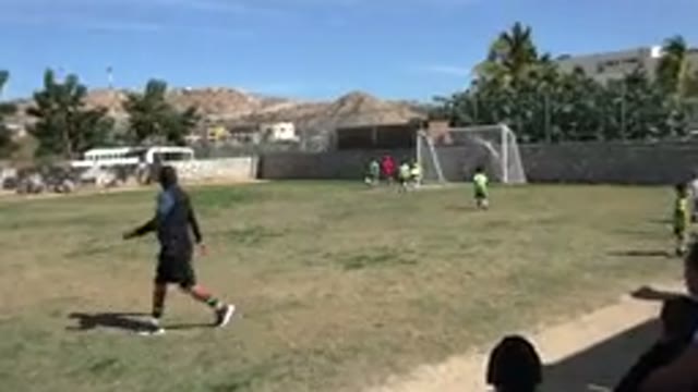 LOS CABOS MEXICO-2019: Small Children Playing Soccer In A Field