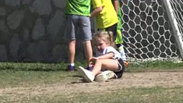 LOS CABOS MEXICO-2019: Little Girl Brushing Dirt Off Her Knees After Falling On