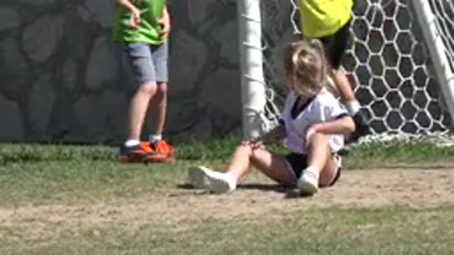 LOS CABOS MEXICO-2019: The Girl Is On The Ground And Three Boys Are Catching A Ball
