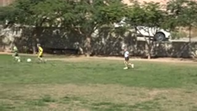 LOS CABOS MEXICO-2019: Children Enjoying A Day In The Park Casually Kicking