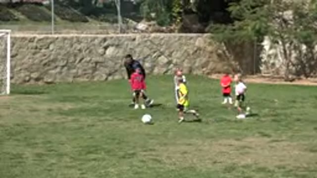 LOS CABOS MEXICO-2019: Kids Running After A Ball While Playing Soccer In The