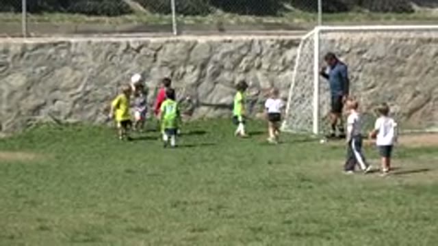 LOS CABOS MEXICO-2019: Children Playing Soccer Outdoors In A Loose Team On A