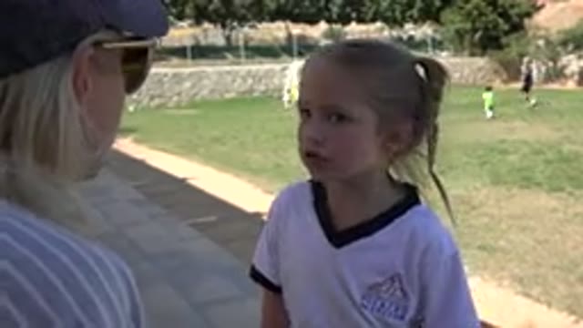 LOS CABOS MEXICO-2019: A Young Girl Talking To An Adult While Others Children Play