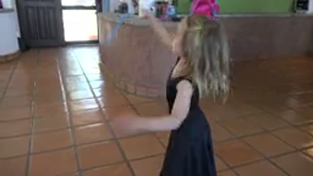 LOS CABOS MEXICO-2019: Young Girl Dancing And Clapping On Tile Floor House