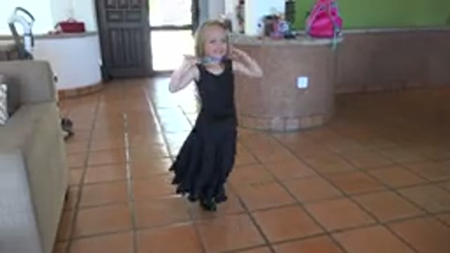 LOS CABOS MEXICO-2019: Little Girl Dancing Happily in a Black Lace Dress