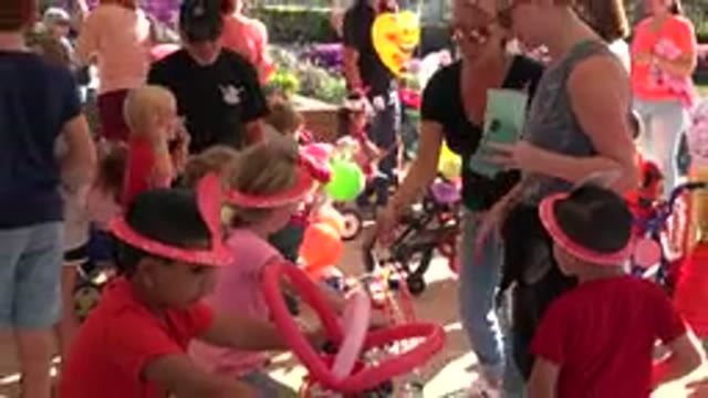 LOS CABOS MEXICO-2019: A Group Of Children On Bikes At A Party With Parents