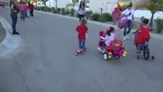 LOS CABOS MEXICO-2019: Kids In A Park Riding Their Bicycles Accompanied By Their Parents