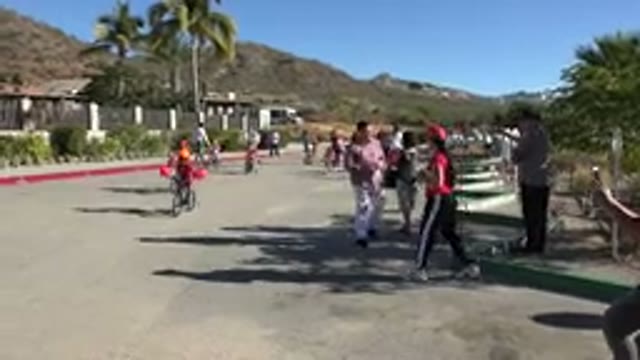 LOS CABOS MEXICO-2019: Children Are Riding On Bicycles Through The Roads With