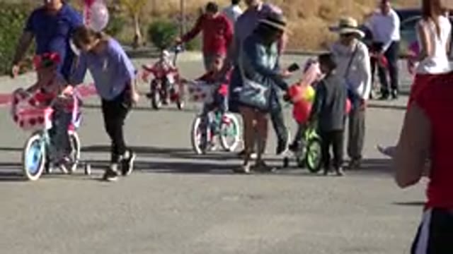 LOS CABOS MEXICO-2019: Children Riding Bikes With Their Families Together