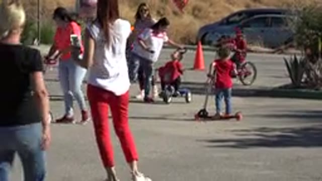 LOS CABOS MEXICO-2019: Families With Children Riding Bikes In The Street In The