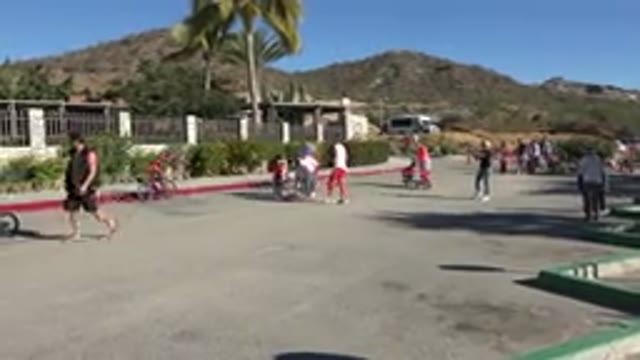 LOS CABOS MEXICO-2019: Families In The Middle Of A Street Playing And Having Fun