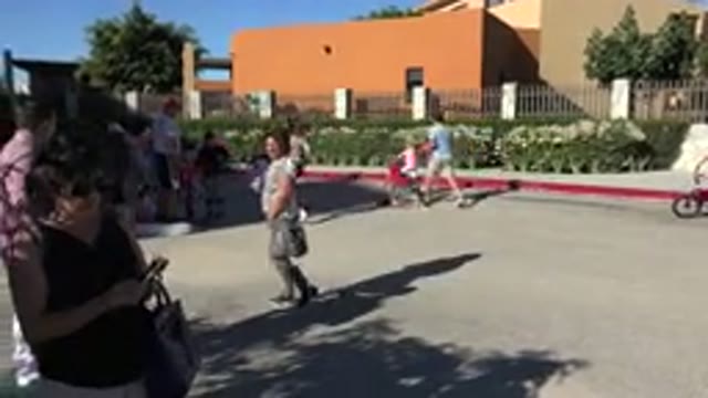 LOS CABOS MEXICO-2019: Group Of Parents With Their Children Fast Walking And