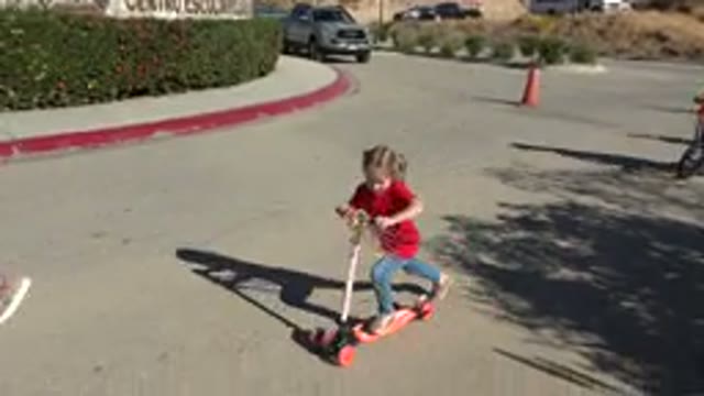 LOS CABOS MEXICO-2019: Child Riding Scooter On Street Full Of People On A Sunny