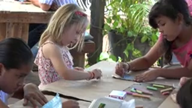 LOS CABOS MEXICO-2019: Children Drawing On A Paper With Coloring Pencils At