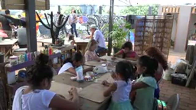 LOS CABOS MEXICO-2019: Seven Girls Children Studying And A Teacher In A Library