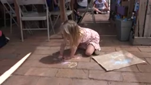 LOS CABOS MEXICO-2019: Little Girl Drawing On The Floor With Colours