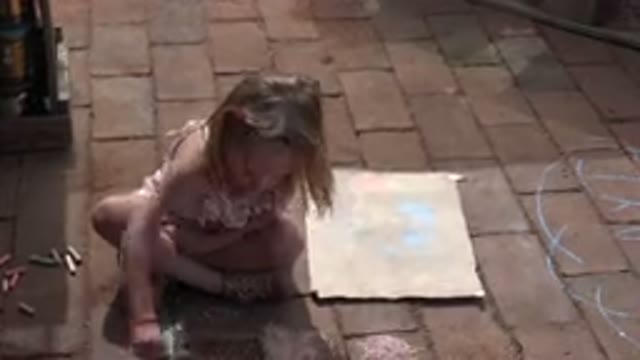 LOS CABOS MEXICO-2019: Creative Girl Creates Bright Chalk Sketches on Sidewalk