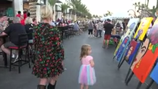 LOS CABOS MEXICO-2019: Mother And Daughter Walking On The Street With Artistic