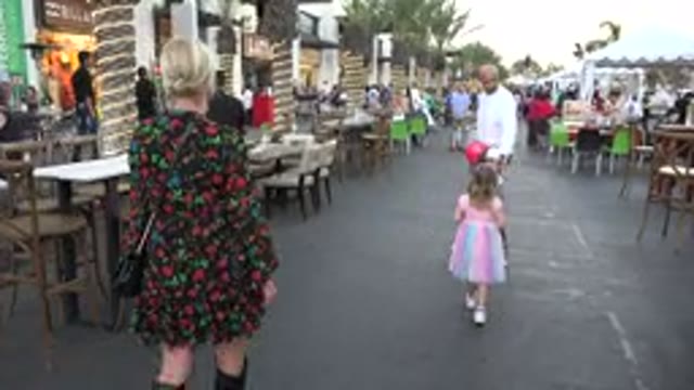 LOS CABOS MEXICO-2019: A Mother Walking Is Surprised When a Man Moves Into Frame