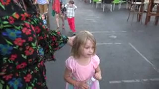 LOS CABOS MEXICO-2019: Blonde Woman in Floral Dress Walking Street Near People