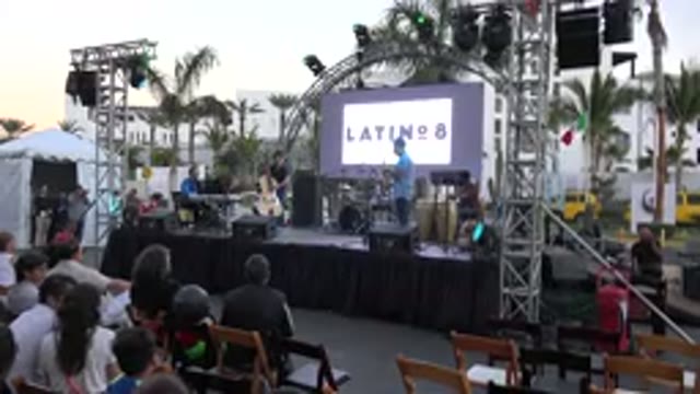 LOS CABOS MEXICO-2019: A Band Playing On Stage For A Crowd Of People At Sunset