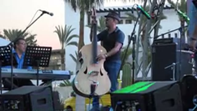 LOS CABOS MEXICO-2019: Three People Band Playing Musical Instruments on Stage