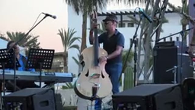 LOS CABOS MEXICO-2019: Man Playing Bass On Stage Is Joined By Keyboardist And