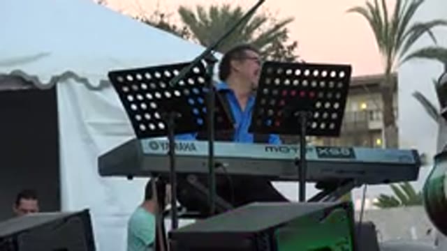 LOS CABOS MEXICO-2019: Keyboardist Laughs and Jokes While Rehearsing the Digital Piano
