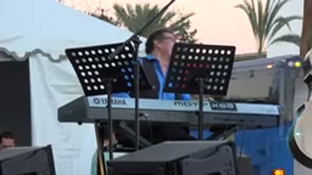LOS CABOS MEXICO-2019: Man Sitting At A Keyboard Playing And Smiling Outside A