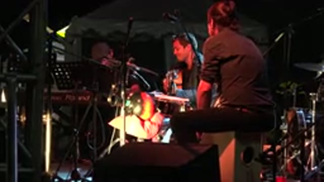 LOS CABOS MEXICO-2019: Man Wearing Black Shirt Sits On Tan Speaker Tapping Drum