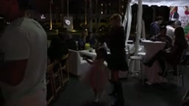 LOS CABOS MEXICO-2019: A Mother And A Daughter Dance In The Middle Of A Crowded