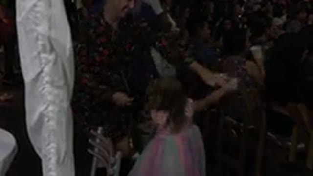 LOS CABOS MEXICO-2019: A Dancing Mother Twirls Her Daughter At An Event