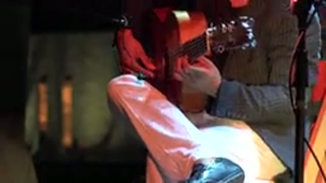 LOS CABOS MEXICO-2019: Man Plays Fingerstyle or Flamenco Style Guitar On Stage