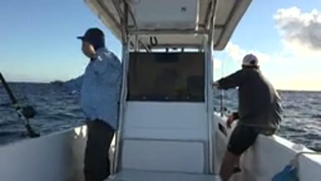 LOS CABOS MEXICO-2019: Two Friends On A Boat In The Ocean To Caught Some Fishes