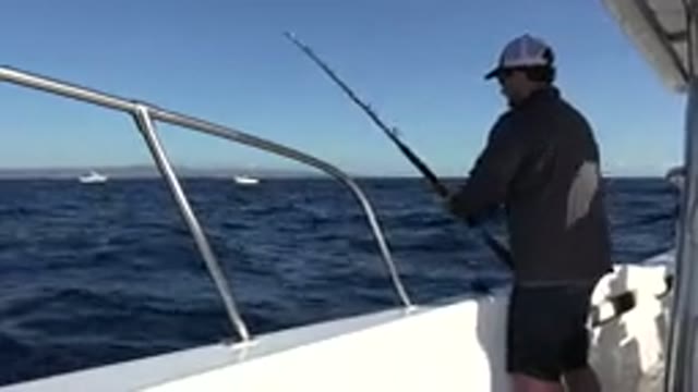 LOS CABOS MEXICO-2019: A Man Engaged In Deep Sea Fishing Reels In His Catch