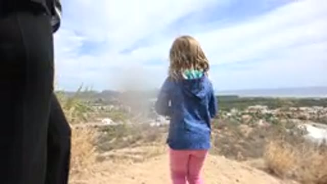 LOS CABOS MEXICO-2019: Little Girl Walking In Arid Ground Next To Her Mother