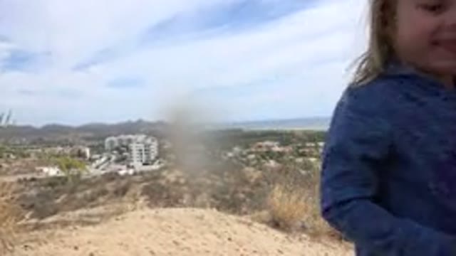 LOS CABOS MEXICO-2019: Little Girl With Blonde Hair In Sweatshirt On Beach