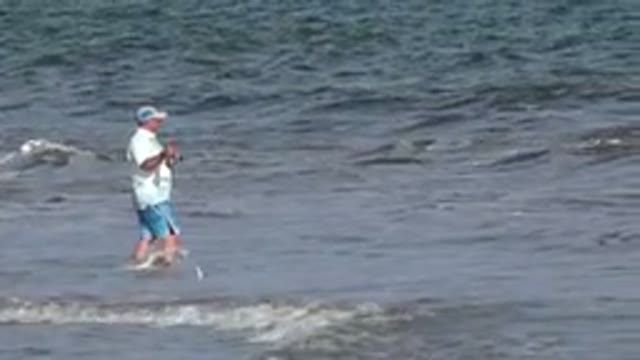 LOS CABOS MEXICO-2019: A Man Enters The Sea And Throws The Fishing Rod