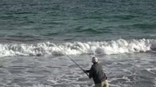 LOS CABOS MEXICO-2019: A Man Fishing On The Shore Of The Ocean
