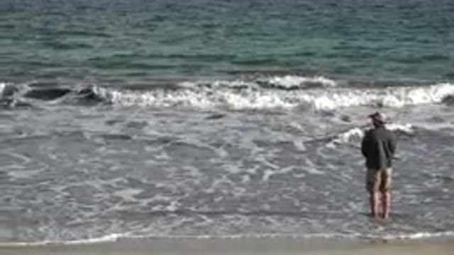 LOS CABOS MEXICO-2019: Adult Man Fishing In The Sea With A Fishing Rod On The